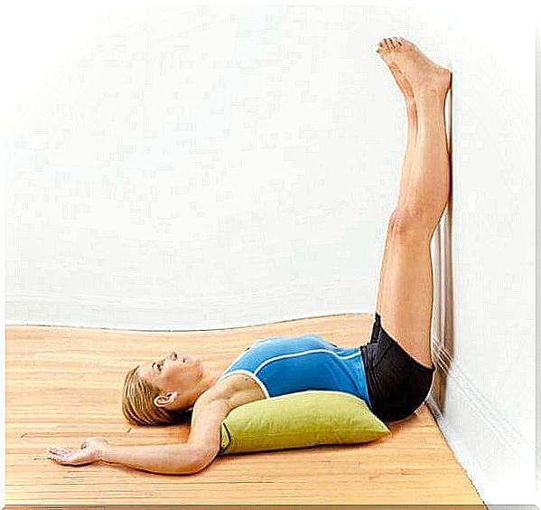 Leg pain exercise with legs against the wall