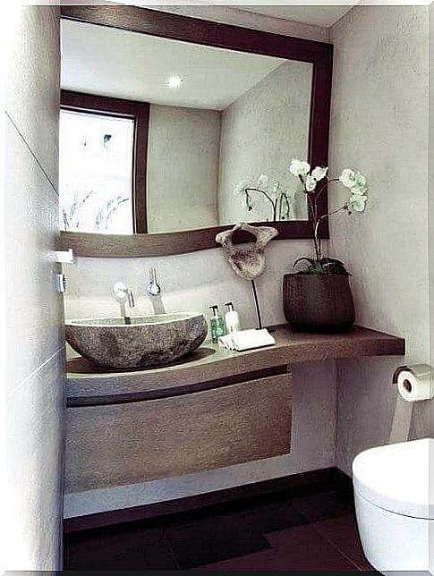 Bathroom with large mirror