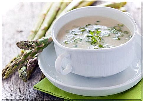 Cup of soup made with green asparagus