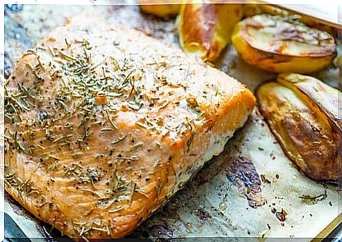 Delicious baked salmon with potatoes and vegetables