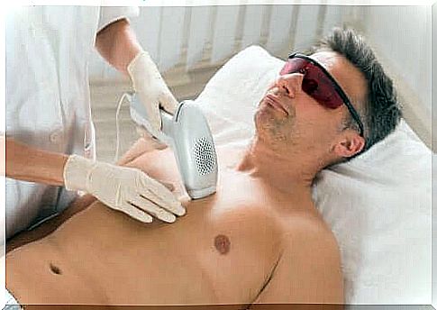 A man gets laser hair removal applied to the chest