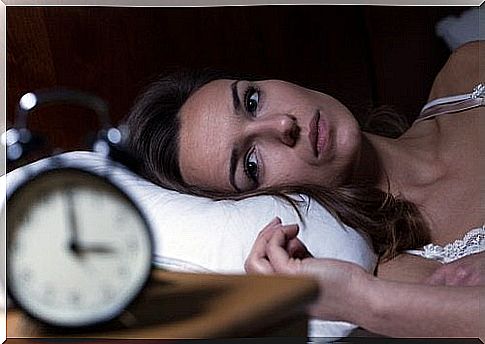 Woman Who Can't Sleep And Is Staring At The Clock