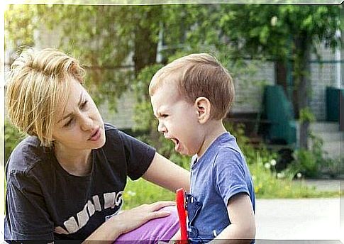 mother comforts crying child