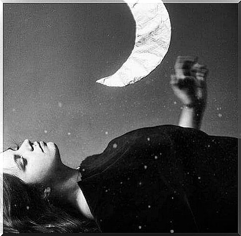 Moon shines above woman