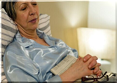 Woman fell asleep with the newspaper