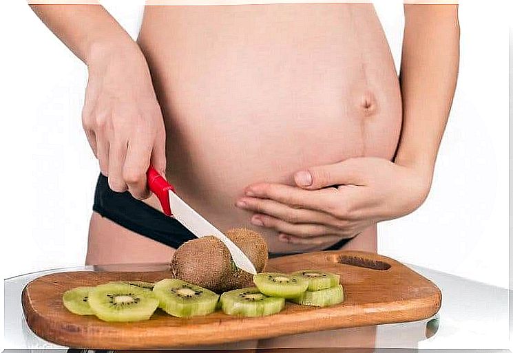 Pregnant woman and kiwi