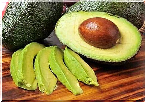 Half an avocado with pit