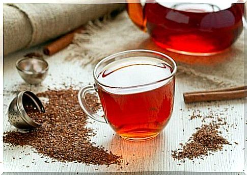 Cup and pitcher with red tea