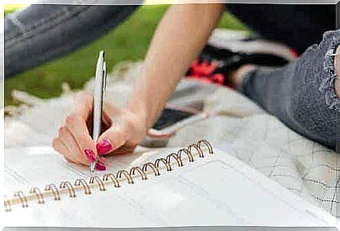 Woman with a notebook and pen