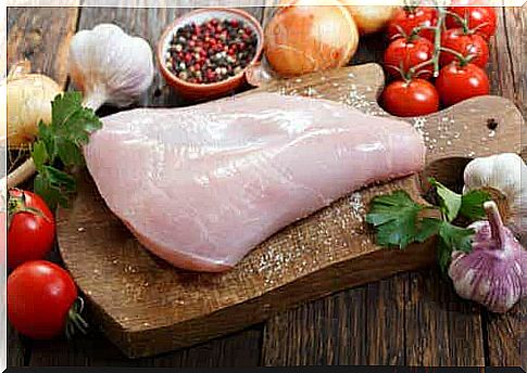 A piece of raw white meat on a cutting board