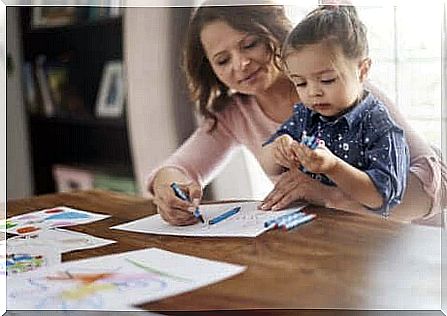 Mother helps child with homework