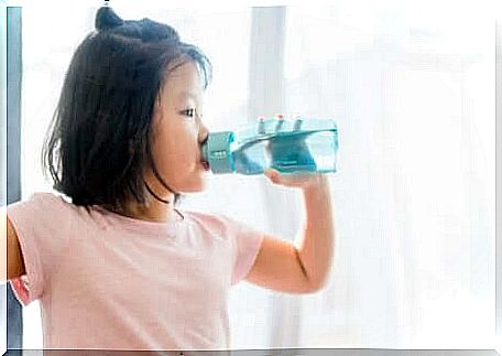 A girl drinks water