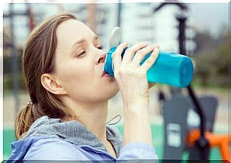 A woman drinks water