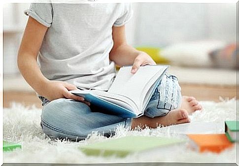 child reads a book