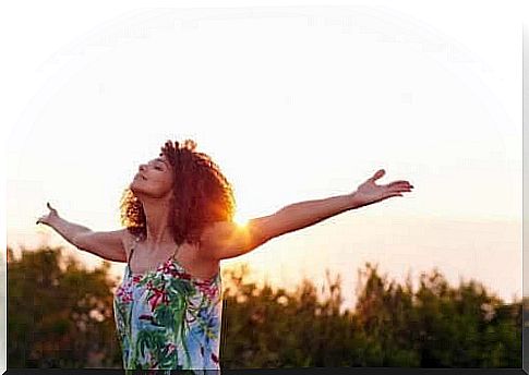 A woman stretches in nature