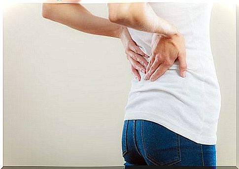 Woman Having Pain In Her Lower Back Example Of Overcoming Your Fears By Listening To Your Body